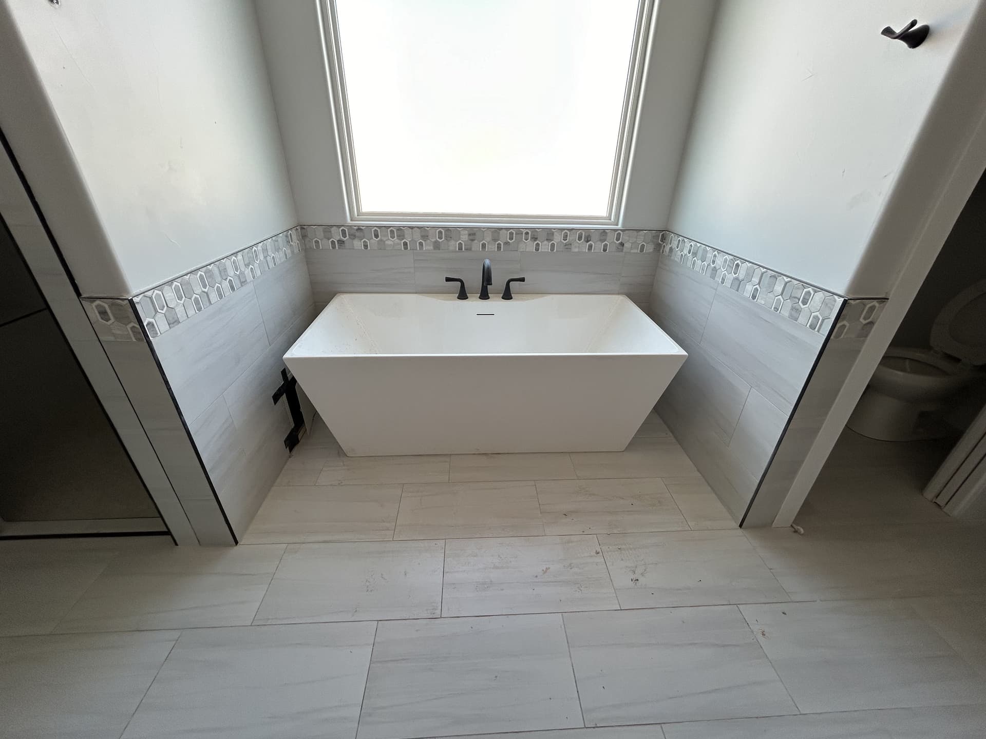 Freestanding Tub Installation for a Custom Home Build image